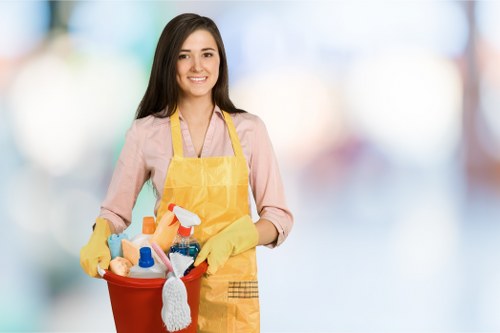Cleaner wearing PPE during a carpet cleaning service